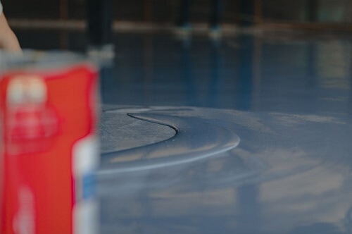 floor being coated with epoxy