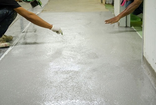 men working on an epoxy floor