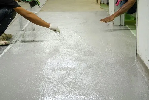men working on an epoxy floor