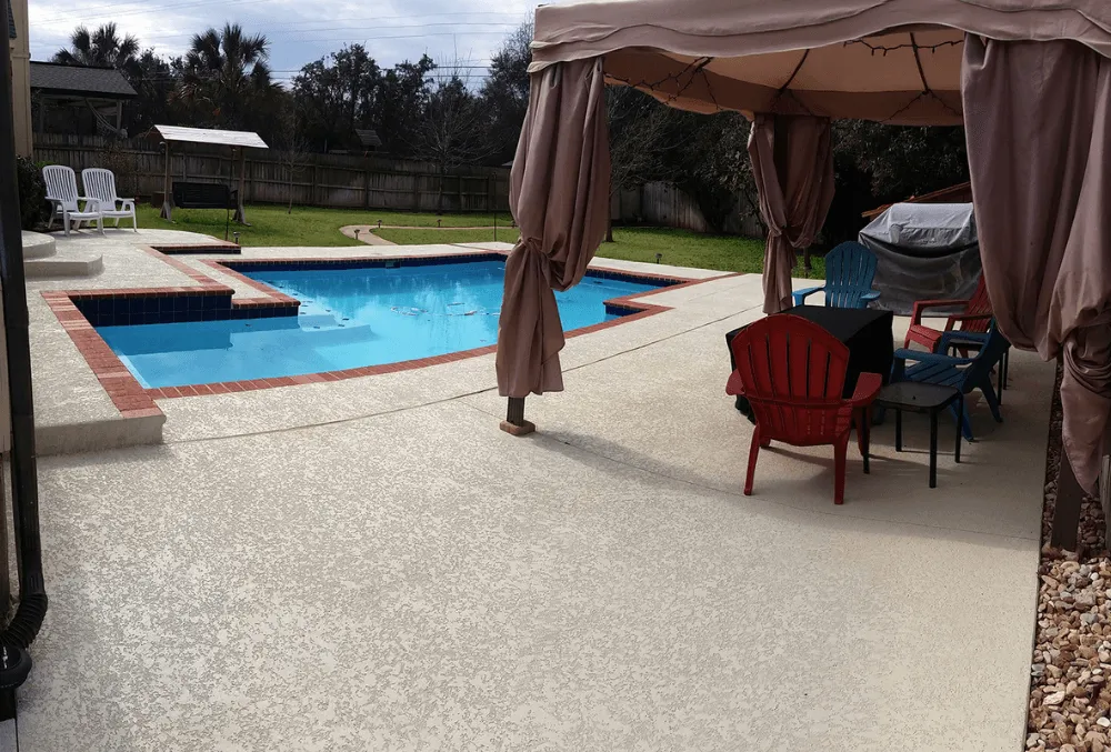 Resurfaced concrete pool deck with smooth, clean concrete finish