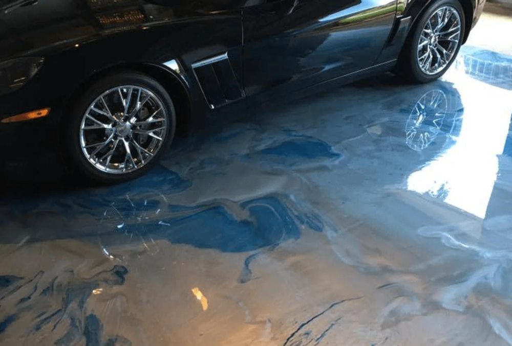 decorative concrete garage floor with blue swirl design