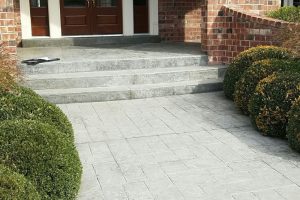 commercial concrete driveway with a wide door