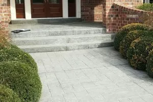 commercial concrete driveway with a wide door