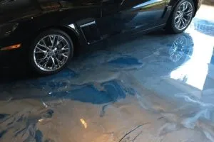 decorative concrete garage floor with blue swirl design