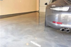silver car on a residential garage floor